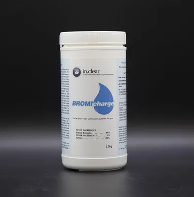 A white plastic container of spa water treatment product against a dark background.