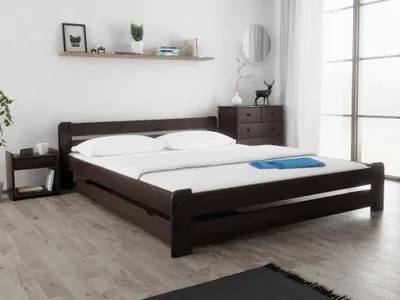 A bedroom scene with a bed, nightstand, and dresser.
