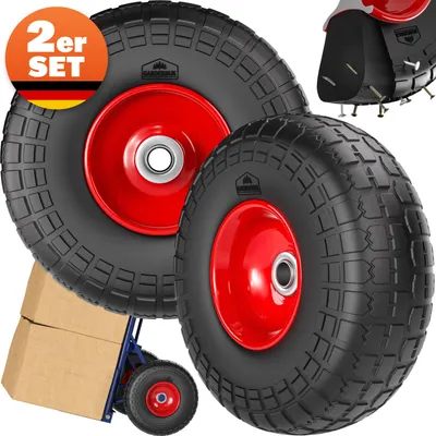 Two large black wheels with red rims are shown, with a smaller wheel and a hand truck with boxes in the background.