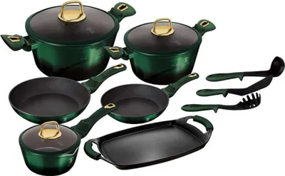 A collection of cookware and kitchen utensils arranged on a white background.
