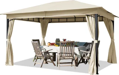 An outdoor gazebo with a table and chairs set up underneath.