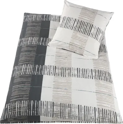 A bedding set including a duvet cover and a pillowcase, laid out on a white background.