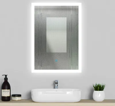 A modern bathroom vanity with a sink, faucet, and an illuminated LED mirror above it.