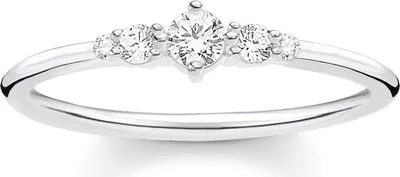 A close-up studio shot of a silver ring with multiple clear stones.