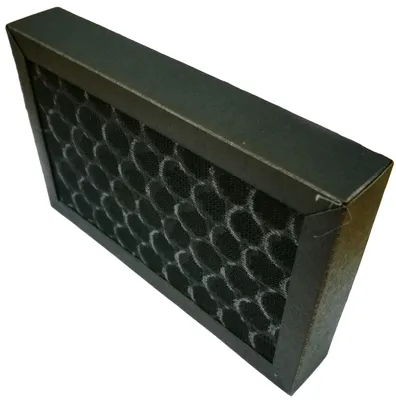 A close-up, angled view of a black air filter with a honeycomb pattern, set against a white background.
