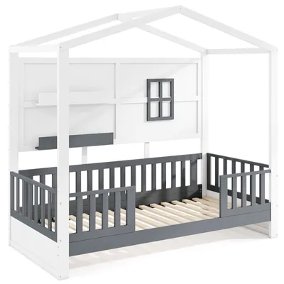 A white and gray house-shaped children's bed with a window and shelves.