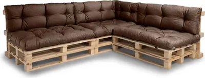 A sectional sofa made from wooden pallets with brown cushions.