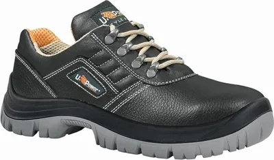 A studio shot of a black work shoe.