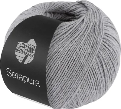 A ball of gray yarn with a black label.