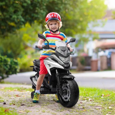 Produktbild von Kinder-Elektromotorrad Honda lizenziert, Stützräder & Scheinwerfer, Elektromotorad Kunststoff-Metall, Weiß | 107 x 46 x 75 cm | 3 km/h | 3–6 Jahre