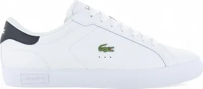 A side view of a white Lacoste sneaker with a navy heel accent.