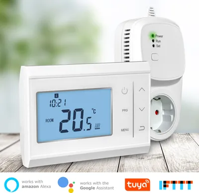 A white thermostat and a white plug adapter are shown on a wooden surface with a blurred background.