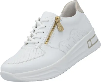 A white sneaker with gold accents is shown against a white background.