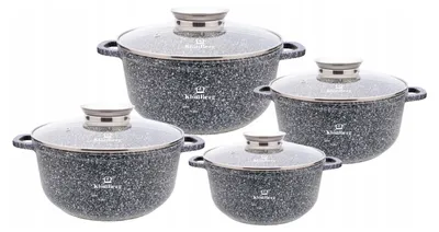 A set of four pots with glass lids, arranged diagonally on a white background.