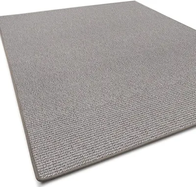 A close-up, angled view of a gray and beige woven rug on a white background.
