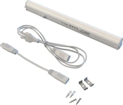 A white LED under-cabinet light with its accessories, including power cords and mounting hardware, laid out on a white background.