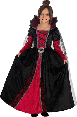 A young girl wearing a vampire costume.