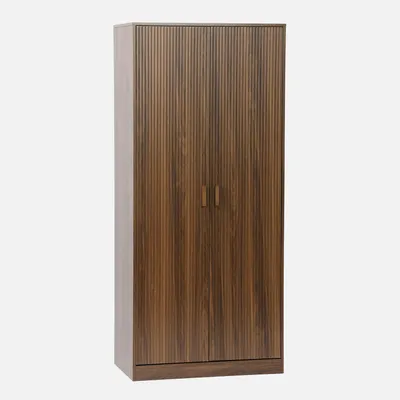A tall, narrow wardrobe with two doors and a ribbed texture on the doors.