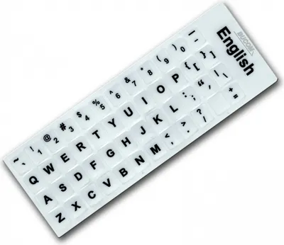A close-up, angled view of a white keyboard sticker sheet with English letters and symbols.