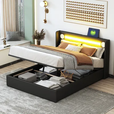 A bedroom scene with a bed that has storage underneath and LED lighting.