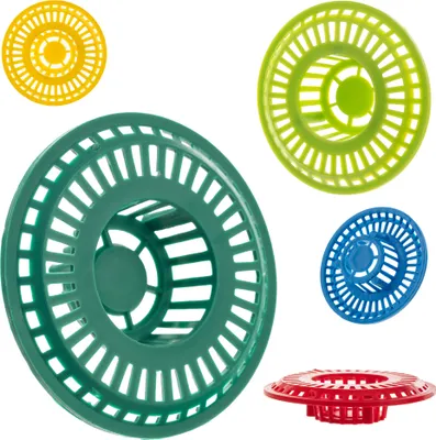 A collection of colorful sink strainers arranged on a white background.