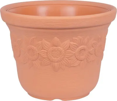 A terracotta flower pot with embossed sunflower designs.