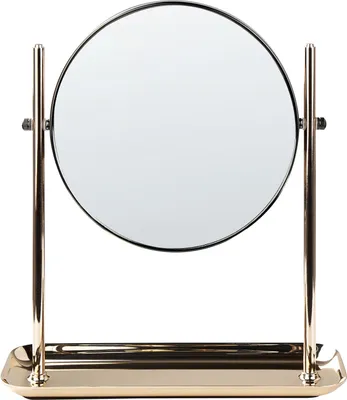 A round, double-sided makeup mirror with a gold-colored metal frame and base, set against a white background.