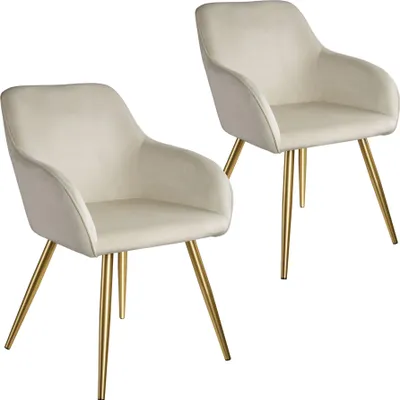 Two cream-colored chairs with gold legs against a white background.