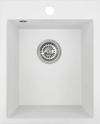 A top-down view of a white kitchen sink with a drain.