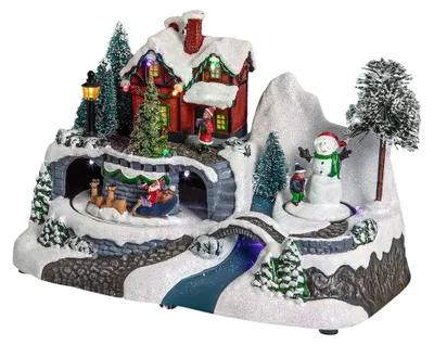 Produktbild von Weihnachtsdorf Weihnachtshaus Weihnachtsszene - 12 LED-Lampen - Musik und Animation - Batteriebetrieb 3 x AA - Für drinnen