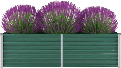 A green metal raised garden bed filled with three purple flowering plants.
