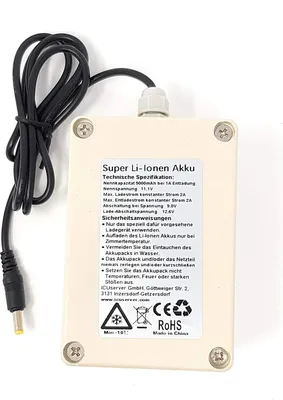 A beige battery pack with a black cable and a label with technical specifications and safety instructions.