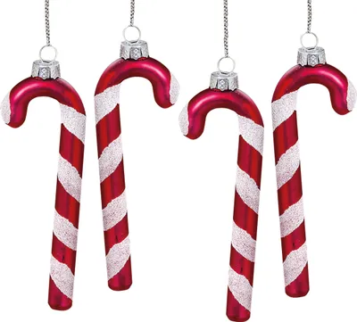 Four red and white candy cane ornaments hanging against a white background.
