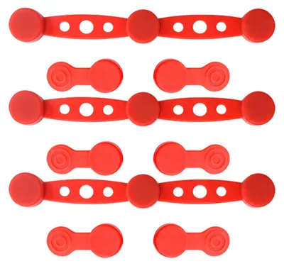 A collection of red silicone clips arranged in rows on a white background.