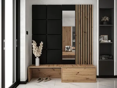 A modern entryway set with a bench, mirror, and wall panels.