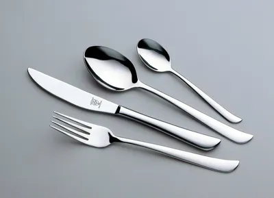 A set of cutlery on a plain gray background.