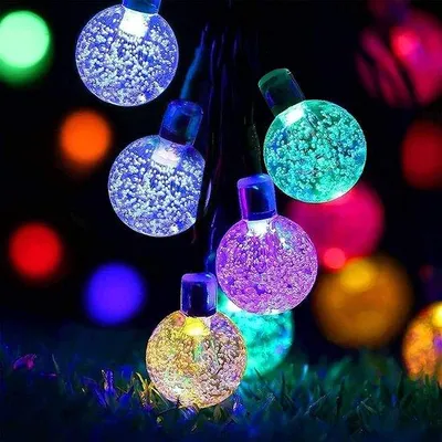 Immagine prodotto di Ghirlanda luminosa a energia solare, 12 m, 66 LED, 8 modalità, cristalli, per giardino e terrazza