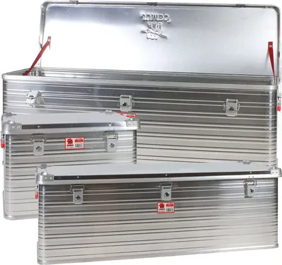 Several aluminum transport boxes are stacked and arranged in the image, with the largest one open.