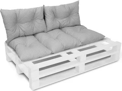 A set of cushions on a white wooden pallet, presented against a white background.
