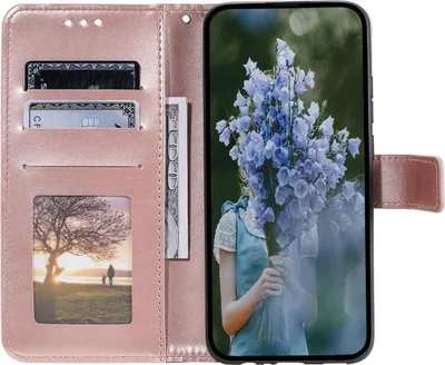 A pink flip phone case is open, showing credit cards and a photo on the left, and a smartphone with a floral image on the screen on the right.