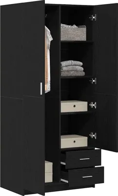 An open black wardrobe with shelves and drawers, showing some folded clothes and boxes.