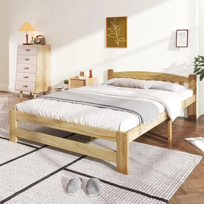 A bedroom scene with a wooden bed frame, nightstand, and dresser.