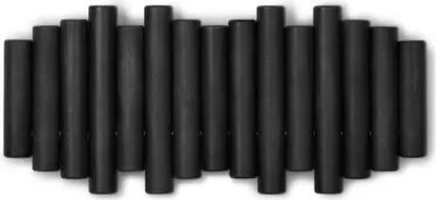 A row of black cylindrical hooks mounted on a white background.