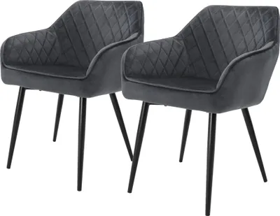 Two gray velvet dining chairs with black metal legs are shown against a white background.