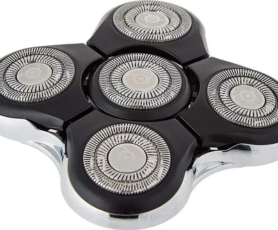 A close-up view of a shaver head with multiple rotary blades.
