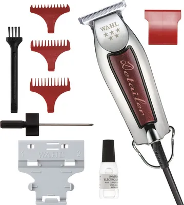 A product shot of a Wahl hair clipper and its accessories on a white background.