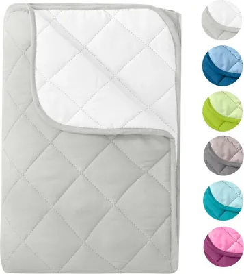 A folded blanket is shown with multiple color swatches on the right side.