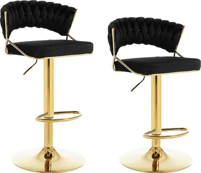 Two black bar stools with gold bases and frames are shown against a white background.