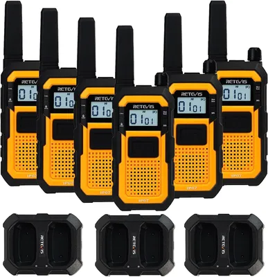 A set of six yellow and black walkie-talkies and two charging docks are arranged on a white background.