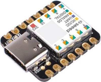 A close-up, angled view of a Seeeduino XIAO microcontroller board with a USB-C connector and various pins labeled with their functions.